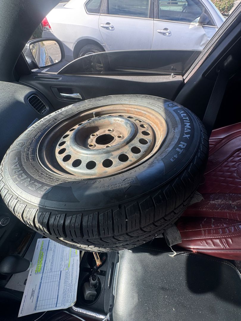 Spare tire riding along after a flat