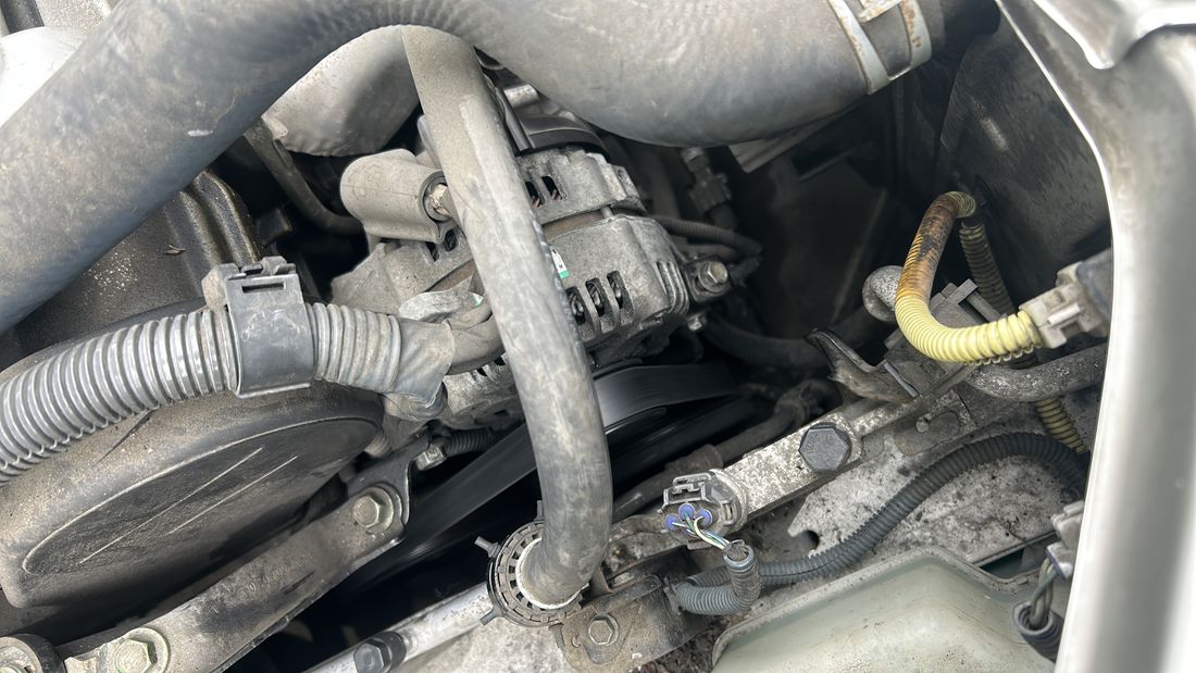 Alternator and hoses during a belt service
