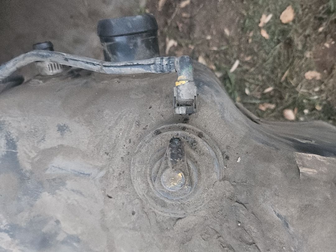 A/C line fitting checked for leaks