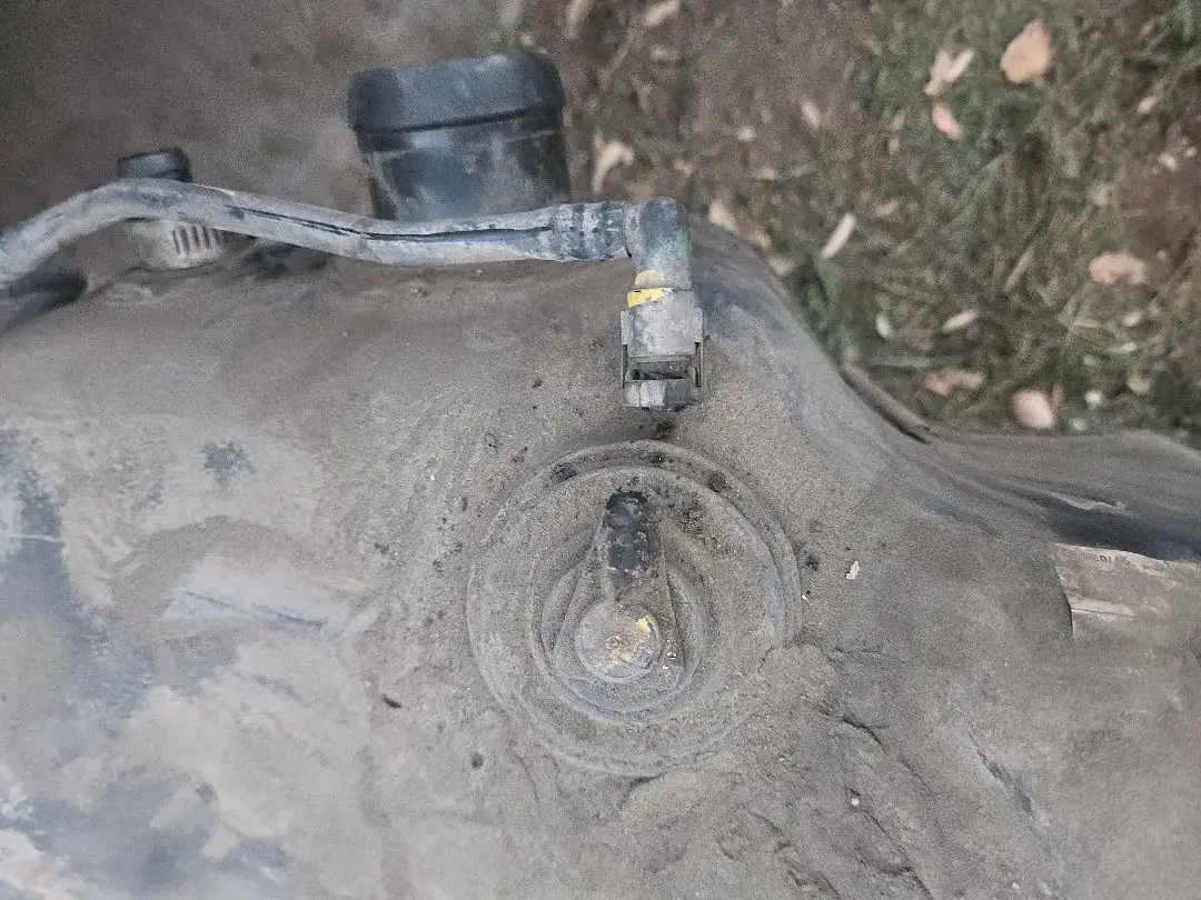A/C line fitting checked for leaks