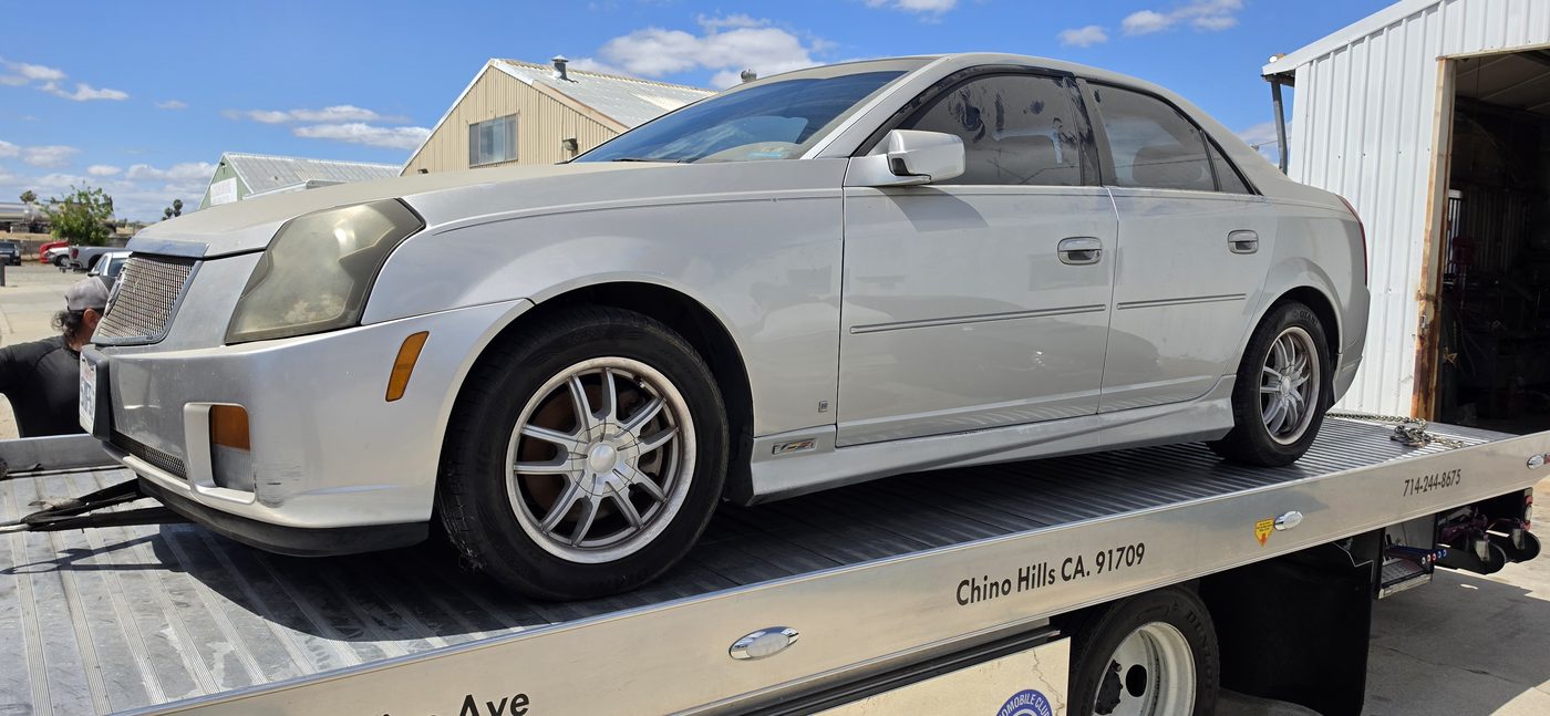 Customer car arriving by flatbed