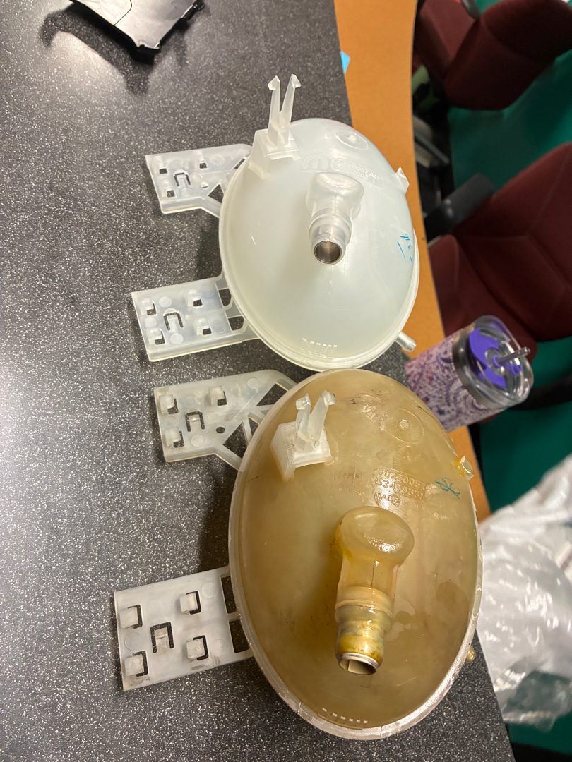 Old vs. new coolant reservoir, side by side
